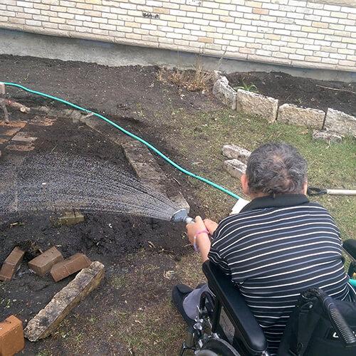 Jim watering the garden