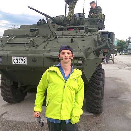 Jarod In Front Of Tank